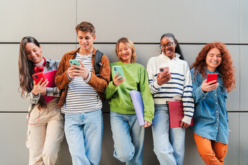 Group of Diverse Teenagers Engaged in Social Media Activities on Smartphones, Sharing Moments and...