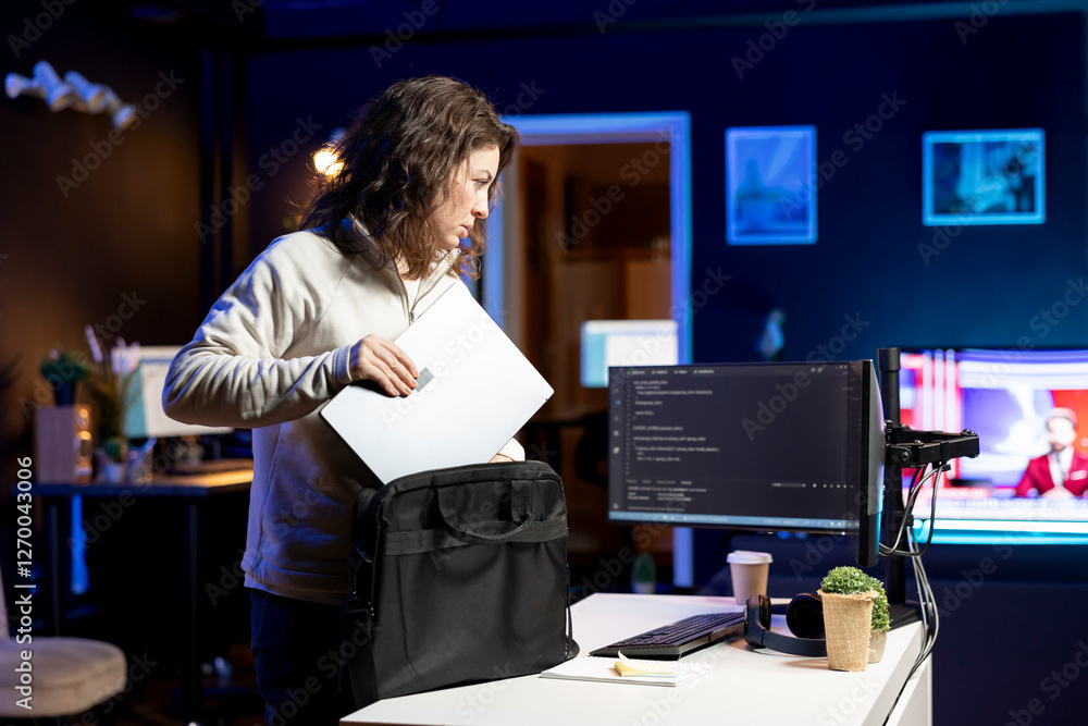 Poster woman packing laptop after finishing doing software quality assurance and reading source code. engin