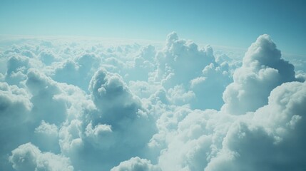 Vast, bright blue sky filled with fluffy white clouds, giving a sense of tranquility and freedom.