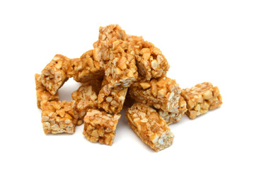 Honey bars with peanuts, sesame and sunflower seeds isolated