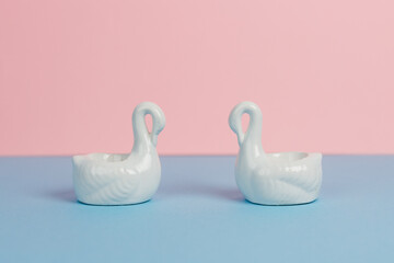 white swan on pink background