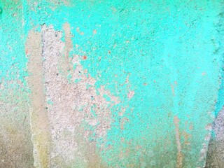 The background of the green paint wall is starting to peel