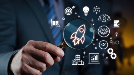 Fototapeta premium Businessman analyzes a startup rocket symbol with a magnifying glass