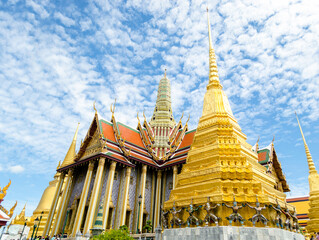 Golden temple under a blue sky in Wat Phra Kaew Bangkok Thailand
