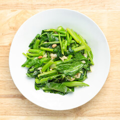 Stir-fried kale vegetables in a bowl.