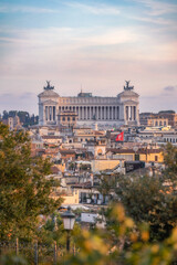 View of the Victor Emmanuel II Monument and sprawling Italian city just before sunset.
