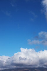 Blue sky with white fluffy clouds