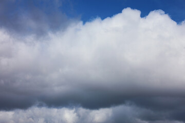 Blue sky with white fluffy clouds