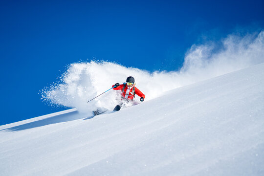 Woman Powder Skiing in fresh powder snow, Sportgastein, Salzburg, Austrian Alps, Austria