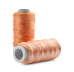 Spools of bright sewing threads isolated on white