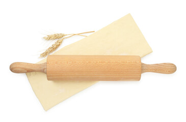 Fresh dough, rolling pin and spikes isolated on white, top view