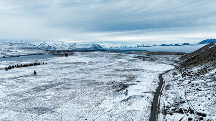 Rural agricultural land covered in snow near Lake Tekapo