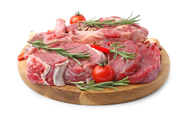 Pieces of raw beef meat, spices and tomatoes isolated on white