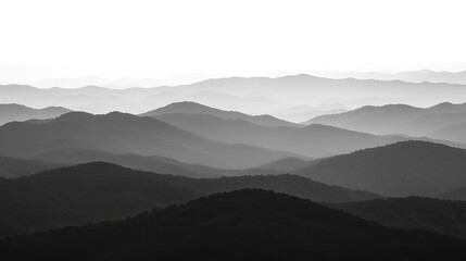 Serene monochrome mountain landscape showcasing layered hills fading into the horizon