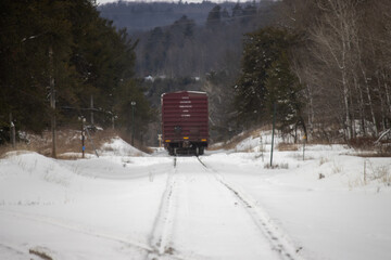 Fototapeta premium A boxcar on the railroad tracks in the winter