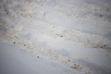 Snow with tire tracks