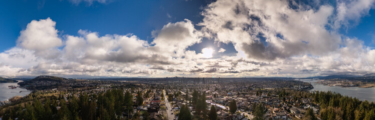 Panoramic View of a Lush Cityscape Under a Partly Cloudy Sky