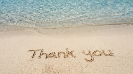 Fototapeta premium Thank you is written in the sand near water