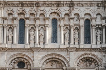Obraz premium Romanesque Church Facade with Arches, Columns, and Sculptures in Soft Light, Stone Texture, Architectural Detail