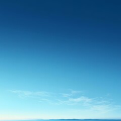 Obraz premium A serene blue sky with soft white clouds, creating a tranquil atmosphere