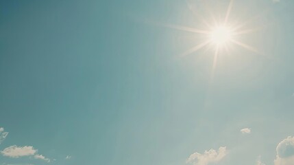 Bright sunny sky with scattered clouds, showcasing a serene atmosphere and clear weather