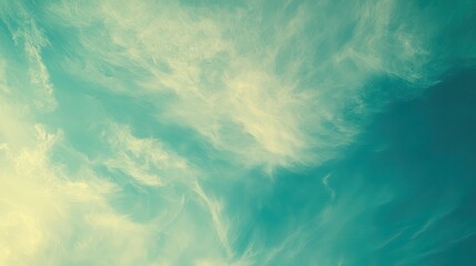 Serene sky with soft clouds transitioning from light blue to teal, evoking tranquility