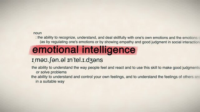 "Emotional Intelligence" word appearing in a dictionary animation. Represents self-awareness, empathy, and interpersonal skills