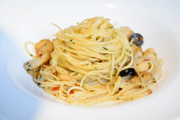 Aglio olio with olives, peperoncino and parsley powder