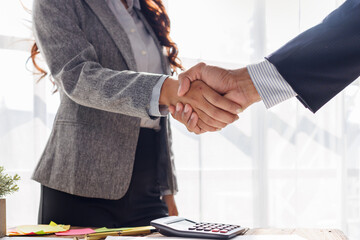 Trusted partner. Businessmen making handshake with partner, Businesswoman handshake and business...