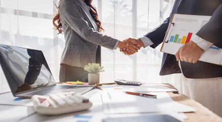 Trusted partner. Businessmen making handshake with partner, Businesswoman handshake and business...
