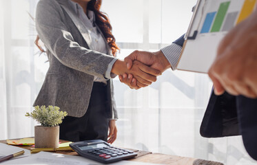 Trusted partner. Businessmen making handshake with partner, Businesswoman handshake and business...