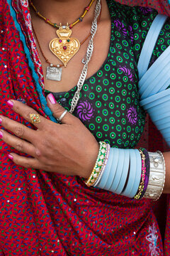 Asia, India, Gujarat,Dasada. Rabari, Mir tribes people. Traditional clothing, scarves, jewelry, daily activities.