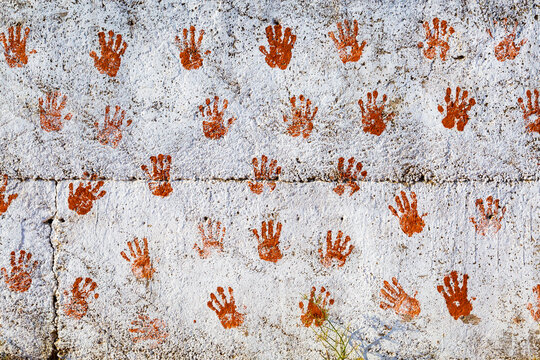 Asia , India, Gujarat. White plaster walls with hand prints. Good luck symbol.