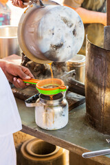 Asia, India, Delhi, Udaiapur, Bera. Making tea.