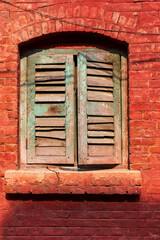 Asia, India, West Bengal, Kolkata near Sealdah Railway Station at Koley crossing. Shuttered window.