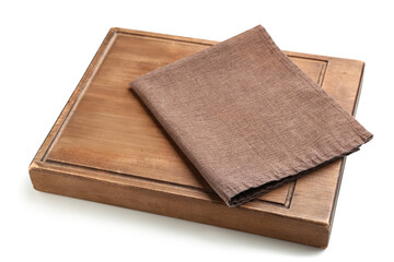 Wooden cutting board and brown napkin on white background