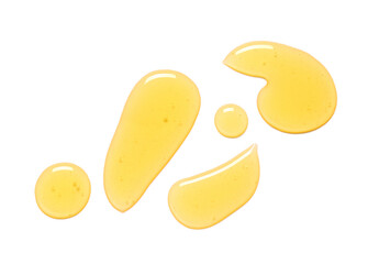 Drops of spilled sweet honey isolated on white background