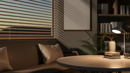 A close-up of a round table in a cozy contemporary living room, illuminated by a lamp on the table.