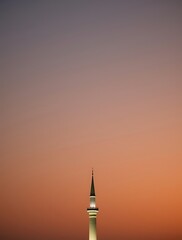 Minaret Tower Against Gradient Sky During Sunset Religious Architecture View