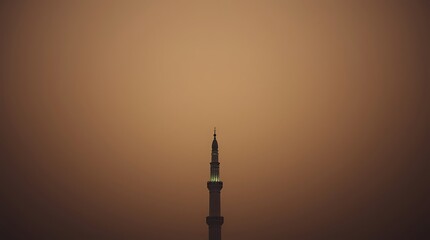 Minaret Silhouette at Dusk with Glowing Lights and Brown Background