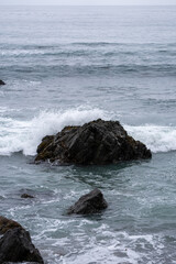 waves crashing on rocks