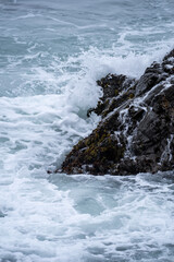 waves crashing on rocks