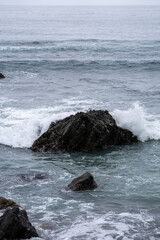 waves crashing on rocks