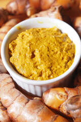 Fresh turmeric paste prepared with natural ingredients at a kitchen