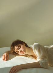 Serene Young Woman Relaxing on Bed
