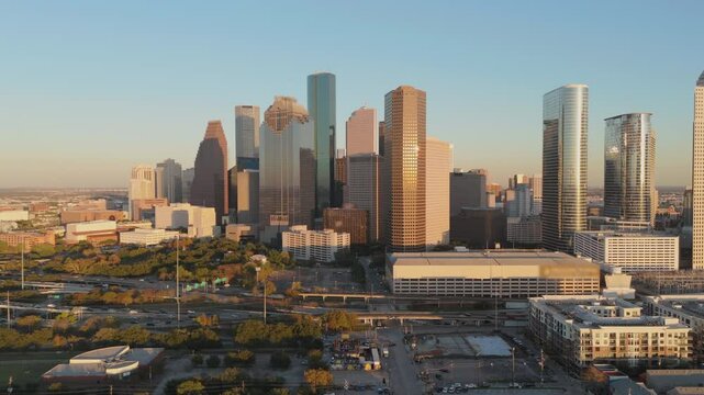 Aerial view highlights the vibrant skyline of Downtown Houston, showcasing its modern architecture and lush green spaces that embody the essence of urban life in this dynamic city. Houston, Texas, USA