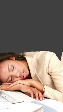 Businesswoman sleeping on her desk