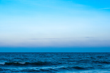 Nature of the beach and sea Summer with sunshine, sandy beaches, clear blue waters sparkling against the blue sky. On an island with good ecology and environment Background for summer vacation