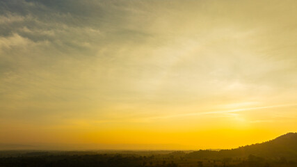 Fototapeta premium Enjoy a panoramic view of the skyline. The sun rises in the morning sky with colorful clouds. and beautiful cloud patterns In the soft light of the morning 