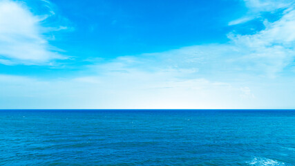 Nature of the beach and sea Summer with sunshine, sandy beaches, clear blue waters sparkling against the blue sky. On an island with good ecology and environment Background for summer vacation